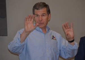 Gov. Roy Cooper speaks to first responders in Rockingham following Hurricane Florence in 2018.