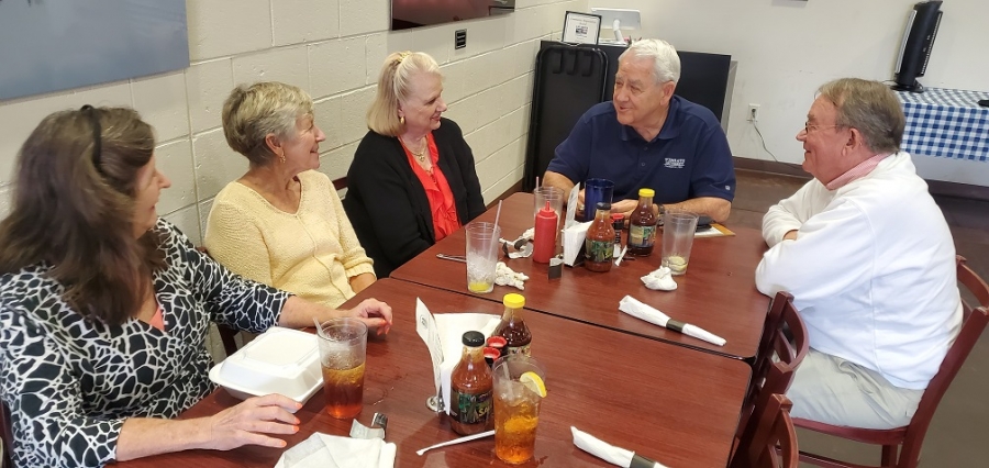 Graduates of Rockingham High School discuss plans for an upcoming reunion. Pictured, from left: Catherine Pasko Jones, Jean Way, Cooper McLaurin, Jerry McGee, Keith McLester.