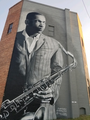 A mural of jazz legend John Coltrane on the back of the old Hamlet Theatre was recently completed by artist Scott Nurkin.