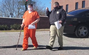 Hamlet PD Lt. Donald Ray Morton, right, escorts 45-year-old Darrin Coke Bryant to the Richmond County Magistrate&#039;s Office on Dec. 22. Bryant is accused of stealing an equipment trailer belonging to The Ponder Project and a Cadillac from Griffin Automotive in October 2019.