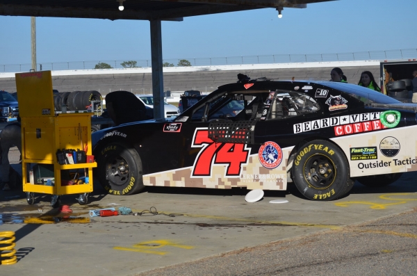The No. 74 Xfinity Series car driven by Mike Harmon sits under the backstretch pit shelter at Rockingham Speedway during Motorsport 4the Masses&#039; Motorfest at Thunder Alley event on Nov. 13.
