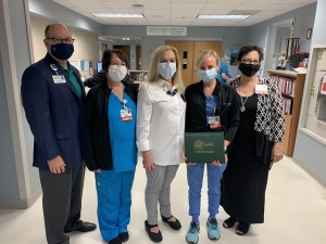 Jonathan Davis, FirstHealth chief operating officer, Tammy Hussey, R.N., Karen Robeano, former chief nursing officer, Courtney Gunther, R.N., and Deana Kearns, administrative director, corporate education &amp; professional development.