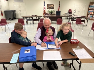 Rep. Jamie Boles, R-Moore, joined by his grandchildren, files for reelection to the N.C. House of Representatives on Feb. 24.