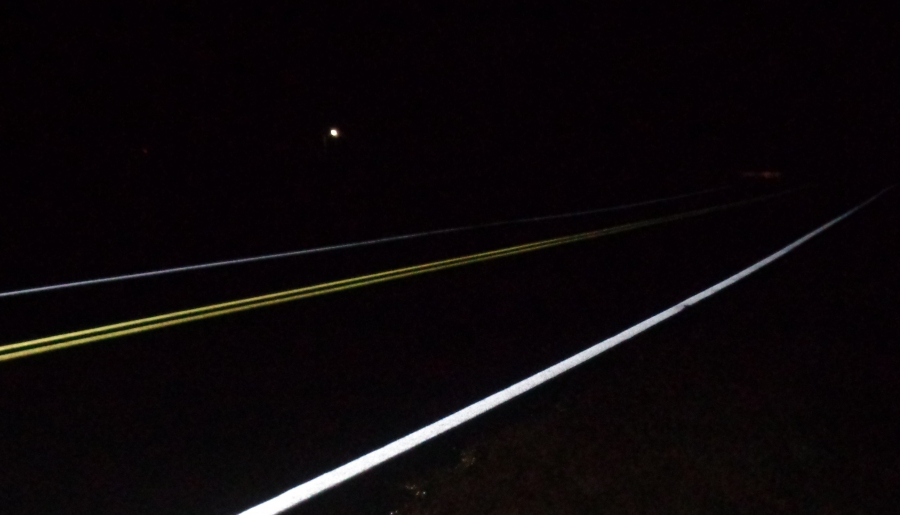 This photo was taken at night soon after long-life/high-visibility lane markings were striped on North Lynnbank Road in Vance County.