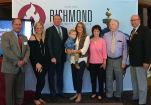 Members of the Robinette family, including Kenneth and Claudia (center), unveiled their Lois Smith Memorial Scholarship for Future Teachers. Pictured left to right: Dr. Hal Shuler, associate vice president of development for RichmondCC; Gabrielle Goodwin, daughter of the Robinettes; Kenneth Robinette; Claudia Robinette, holding grandson Grey; Pam McKay and Frank McKay; and Dr. Dale McInnis, president of RichmondCC.