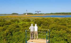 Drone spraying operations near Bodie Island Lighthouse.