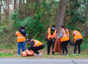Students from Richmond Early College&#039;s Eco Club pick up trash along Wiregrass Road March 12.