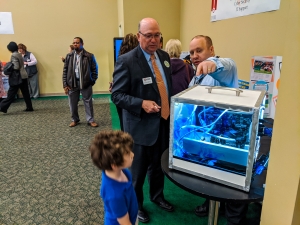 Cyber Security instructor Brian Goodman shows off the computer he made to Dr. Dale McInnis, president of Richmond Community College, during an open house of the College’s programs. RichmondCC will host a Program Fair on April 20 at the Cole Auditorium on the Hamlet Campus.
