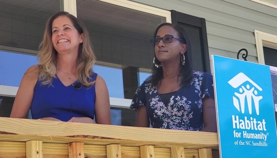 Amie Fraley, executive director of Habitat Humanity of the N.C. Sandhills, goes live on Facebook with new homeowner Amber Baldwin in Hamlet on June 24.