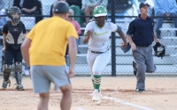 Senior Allyiah Swiney runs down the first base line on the first of her two homers in Tuesday&#039;s win.