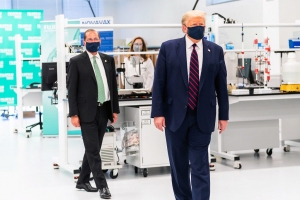 President Trump, foreground, and U.S. Health and Human Services Secretary Alex Azar visit the Fujifilm Diosynth facility in Research Triangle Park July 27, 2020. 