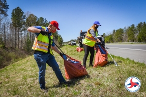 N.C. Board of Transportation Division 8 Representative Lisa Mathis and Division Engineer Brandon Jones pick up trash with a crew Tuesday along U.S. 421 Bypass in Sanford.