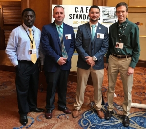 School of Business professors Drs. Cliff Mensah (left) and John Parnell (far right) pose with UNCP seniors Joey Bartch and Josh Brooks at the 2019 Association of Private Enterprise Education International Conference.