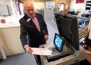 Tom Janyssek from Printelect demonstrates a high-tech voting machine to the Richmond County Board of Elections on Tuesday.