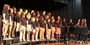 The Rockingham Middle School advanced chorus, under the direction of Lauren Lutz, performs for the class of 1972.