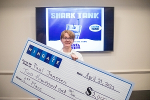Senior Paul Janssen celebrates winning first place in Wingate University&#039;s Shark Tank competition.