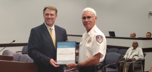 Matthew Selves, public safety risk management consultant with the N.C. League of Municipalities, presents Rockingham Police Chief Billy Kelly with a plaque for the department’s completion of a Public Safety Risk Management Review