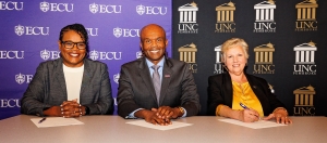 From left, LaKesha Alson Forbes, ECU associate provost for equity and diversity; Dr. Grant Hayes, ECU interim provost and senior vice chancellor for Academic Affairs; and Dr. Zoe Locklear, UNCP Interim Provost and vice chancellor for Academic Affairs, sign a memorandum of understanding between the two universities.