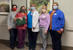 From left: Deana Kearns, R.N., administrative director, corporate education and professional development; Justyna Iskrzycki, R.N.; Kay Boroughs, R.N.; Karen Robeano, DNP, R.N., chief nursing officer and vice president, patient care services; and Dee Anna Johnson, R.N., administrative director, transfer center.