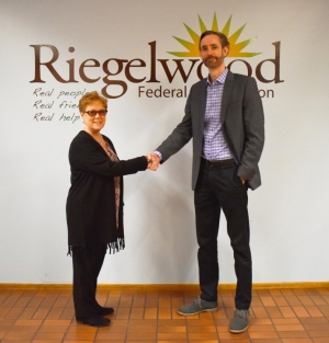 REV President and CEO, Jason Lee, and Riegelwood Federal Credit Union president and CEO, June Bigford.