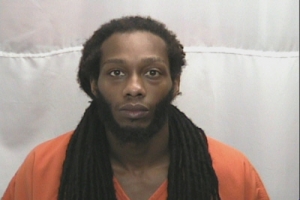 Dominque Lamont Hubbard is accused of having two stolen handguns and nearly a half-ounce of marijuana when his home was searched by the Hamlet Police Department on Friday.