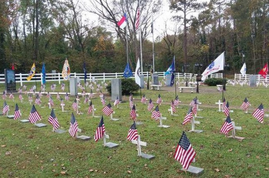Small U.S. flags adorn the grounds of Veterans Memorial Park, where a Veterans Day service will kick off a day of events on Saturday.